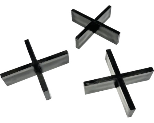 Drie zwarte tegelkruisjes