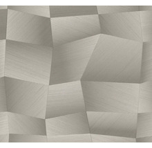 Grijs vliesbehang met geometrisch driedimensionaal patroon van onregelmatige veelhoeken en fijne lijnstructuur.