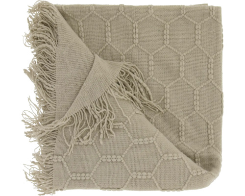 Gebreid plaid met honingraatpatroon en franjes.