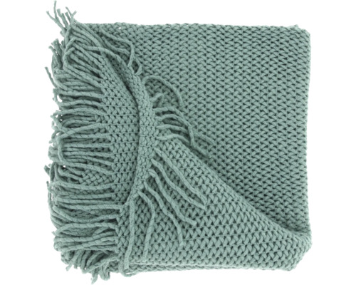 Grof gebreid groen plaid met decoratieve franjes.