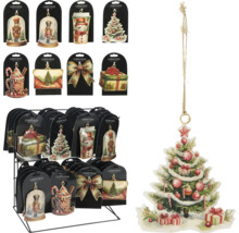 Diverse platte kerstboomhangers met vintage illustraties van kerstbomen, notenkrakers en sneeuwpoppen op een displaystandaard.