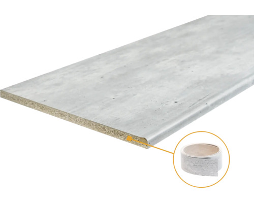 Werkblad met spaanplaatkern en laminaatoppervlak in grijze betonlook, inclusief bijpassende kantenband en afgeronde voorzijde.