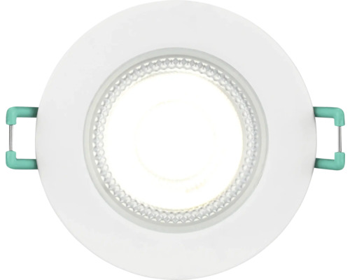 Ronde LED inbouwspot met wit frame en groene montageklemmen.