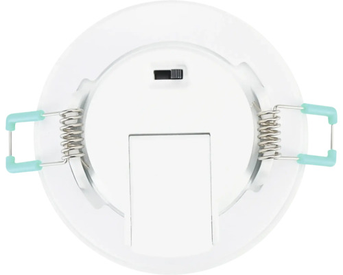 Achteraanzicht van een ronde witte LED-inbouwspot met twee bevestigingsveren en een schakelaar.