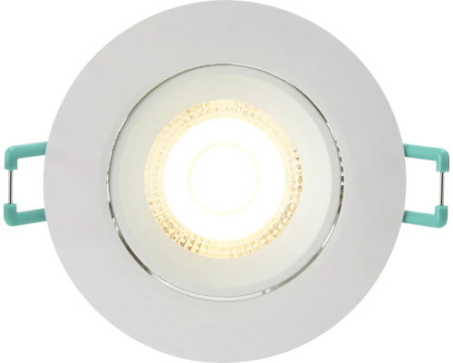 Ronde LED inbouwspot met wit frame, brandende lichtbron en montageklemmen aan de zijkant.