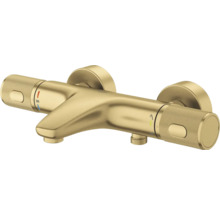 Grohe thermostaatkraan voor bad in geborsteld goud met twee gestructureerde grepen voor wandmontage.