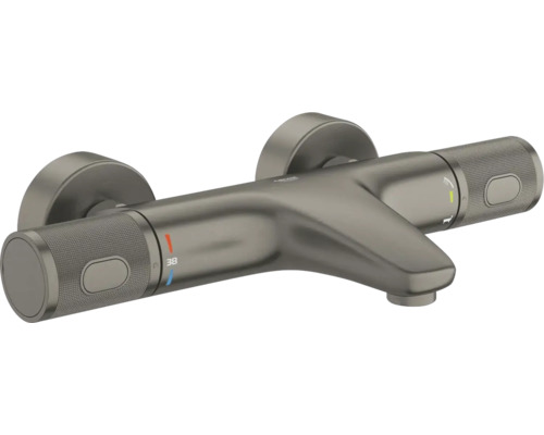 Grohe thermostaat badkraan van geborsteld metaal met temperatuurbeveiliging op 38 graden, geribbelde grepen en Grohe Logo.