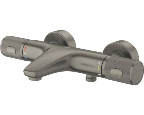 Grohe thermostaatkraan voor bad in geborsteld donker metaal met twee gestructureerde grepen, baduitloop en douche-aansluiting.