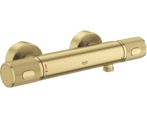 Grohe thermostaat douchemengkraan van geborsteld metaal voor wandmontage met gekartelde grepen en veiligheidsblokkering bij 38 graden.