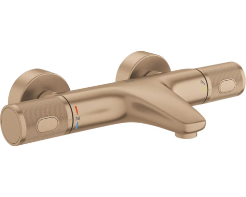 Thermostatische badkraan in bronslook met gekartelde grepen, wandrozetten en temperatuurinstelling op 38 graden.