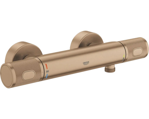 Grohe thermostaat douchekraan voor wandmontage, geborsteld brons, gekartelde grepen, Grohe Logo en temperatuurbegrenzing bij 38 graden.