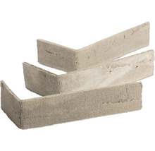Drie beigegrijze steenstrips in L-vorm voor hoeken met een natuurlijke ruwe steenstructuur.