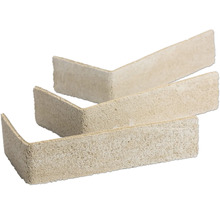 Drie L-vormige hoekstrips in steenlook met gestructureerd oppervlak.