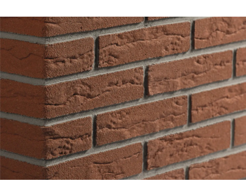 Steenstrips met rode baksteenlook, een gestructureerd oppervlak en grijze voegen voor wandbekleding.