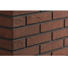 Steenstrips in klinkerlook met een gestructureerd oppervlak en diepe voegen voor wandbekleding.