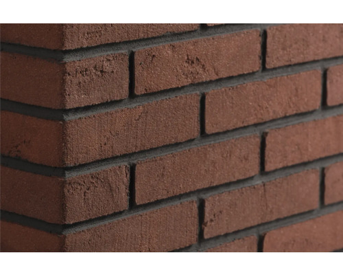 Steenstrips in klinkerlook met een gestructureerd oppervlak en diepe voegen voor wandbekleding.