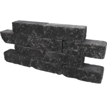 Stapelblokken van beton in antraciet met een gestructureerd oppervlak, opgestapeld als een muur.