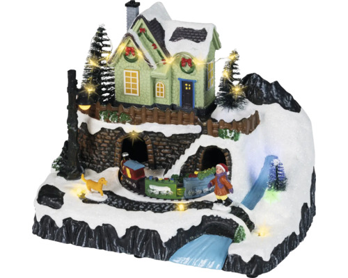 Geanimeerd kerstdorp met een besneeuwde berg, verlicht huis, rijdende trein, figuren und ledverlichting.