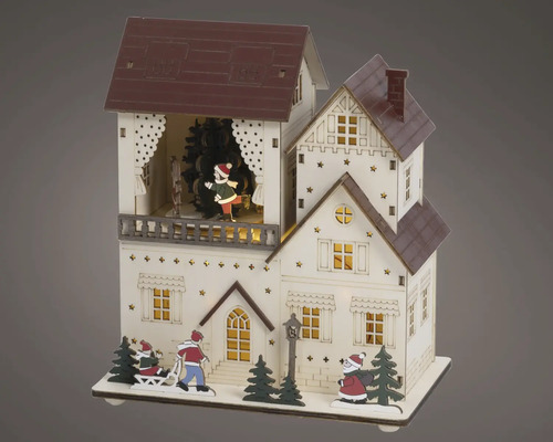 Kerstdecoratie van hout, verlicht huis met schaatsers, de kerstman en kerstbomen.