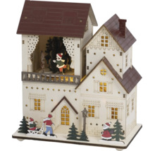 Kerstdecoratie van hout in de vorm van een huis met verlichting, kinderen op een slee, de kerstman en kerstbomen.