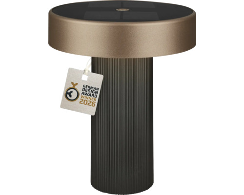 Moderne solar tafellamp met geribbelde voet, platte ronde kap, geïntegreerd zonnepaneel en German Design Award Winner 2026.