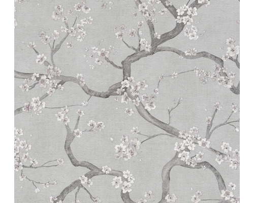 Getextureerd vliesbehang met een patroon van bloesemtakken.