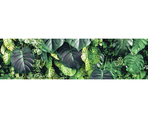 Kunstmatige plantenwand met verschillende tropische bladeren en grote Monstera-bladeren voor wanddecoratie.