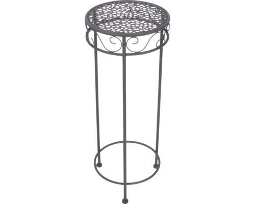 Ronde plantenstandaard van metaal met decoratief gatenpatroon en ornamenten.