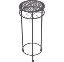 Ronde metalen plantenstandaard met geperforeerd blad en decoratieve krullen.