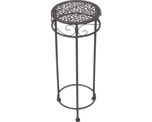 Ronde metalen plantenstandaard met geperforeerd blad en decoratieve krullen.