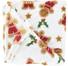 Zachte pluche kerstdeken met motieven van peperkoekmannetjes, hulst en sterren.