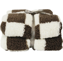 Opgevouwen woondeken met bruin-wit ruitpatroon en strik, zacht pluche materiaal.