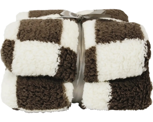 Opgevouwen woondeken met bruin-wit ruitpatroon en strik, zacht pluche materiaal.
