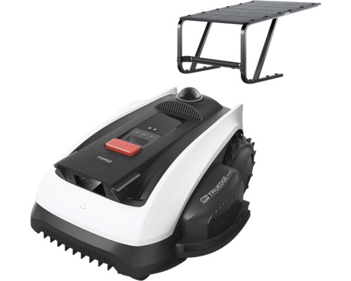 Robotmaaier met garage in zwart en wit, voorzien van een rode stopknop en terreinbanden.
