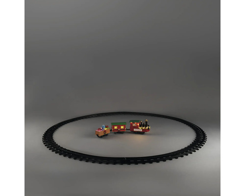 Kersttrein met locomotief, twee wagons en cirkelvormige rails. Locomotief met LED-verlichting en opschrift Express.