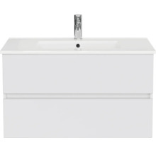 Badmeubelset met een witte wastafelonderkast met twee greeploze laden, een wastafel en een kraan.