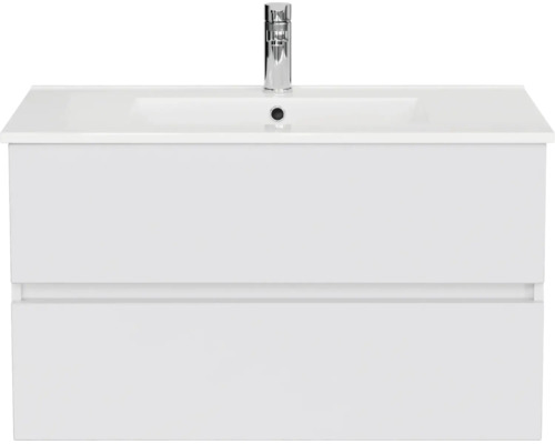 Badmeubelset met een witte wastafelonderkast met twee greeploze laden, een wastafel en een kraan.