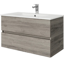 Wastafelmeubel met twee laden in houtlook en witte wastafel inclusief kraan.