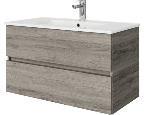 Wastafelmeubel met twee laden in houtlook en witte wastafel inclusief kraan.