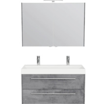 Moderne badkamermeubelset met grijze onderkast in betonlook, twee laden, witte wastafel, twee kranen en een spiegelkast.