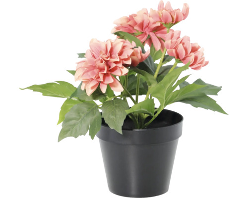 Kunstmatige dahlia in zwarte pot met roze bloemen en groene bladeren.