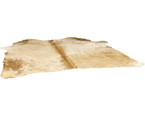 Koeienhuid vloerkleed van echt natuurvacht met onregelmatige vorm.
