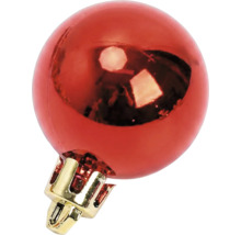 Glanzende rode kerstbal met gouden kapje.