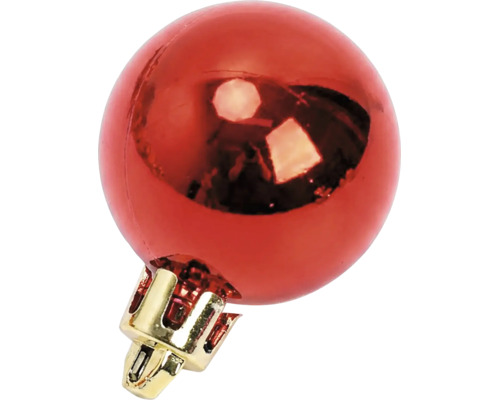 Glanzende rode kerstbal met gouden kapje.