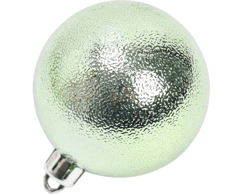 Lichtgroene kerstbal met gestructureerd oppervlak en ophanging.