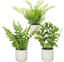 Drie kunstmatige kamerplanten in geribbelde bloempotten voor binnendecoratie.