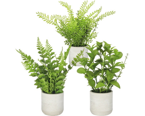 Drie kunstmatige kamerplanten in geribbelde bloempotten voor binnendecoratie.