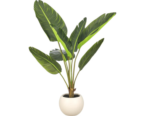 Kunstmatige strelitzia plant in een ronde pot als decoratie voor binnenshuis