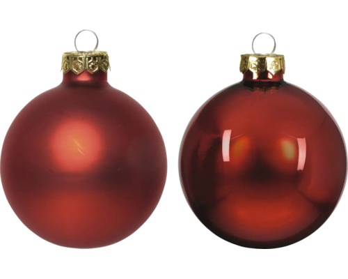 Twee glazen kerstballen, een mat en een glanzend, met bewerkte kap en ophangoog.