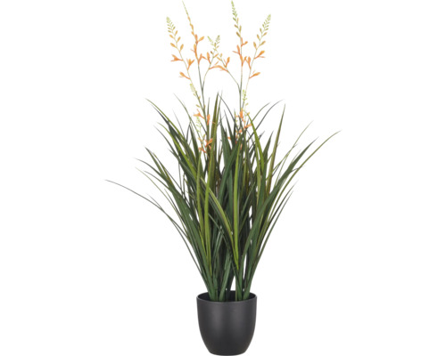 Kunstgrasplant met oranje bloemen in een donkere pot.